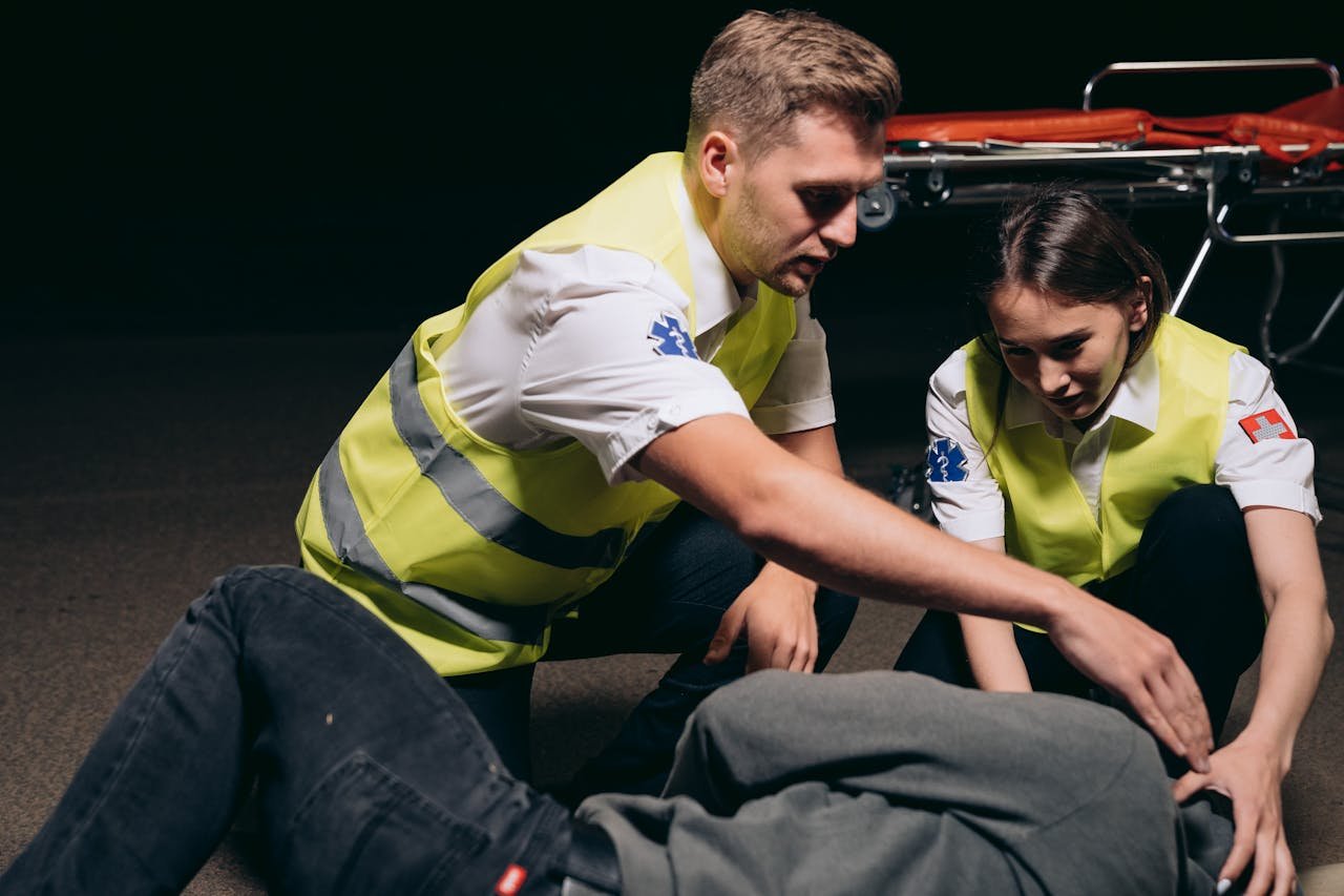 Man and Woman Rescuing a Person